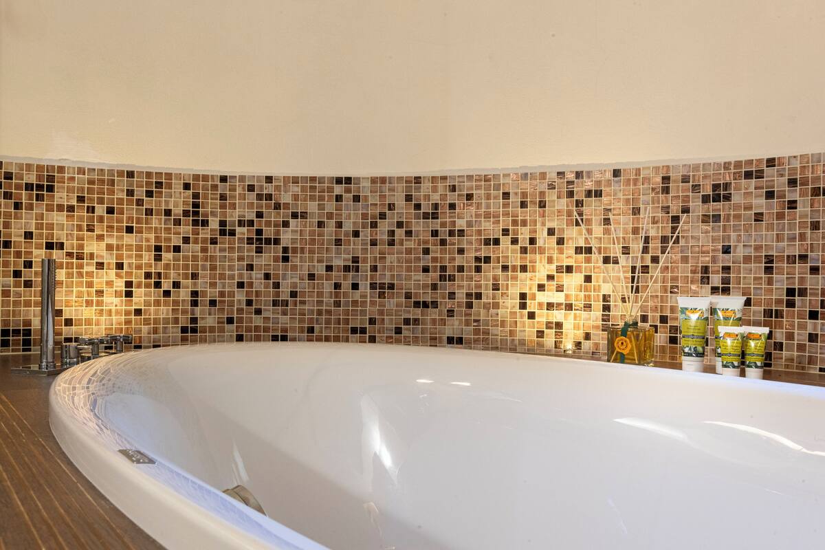 terrace suite | bathroom | eco-friendly toiletries, hair dryer, slippers, bidet