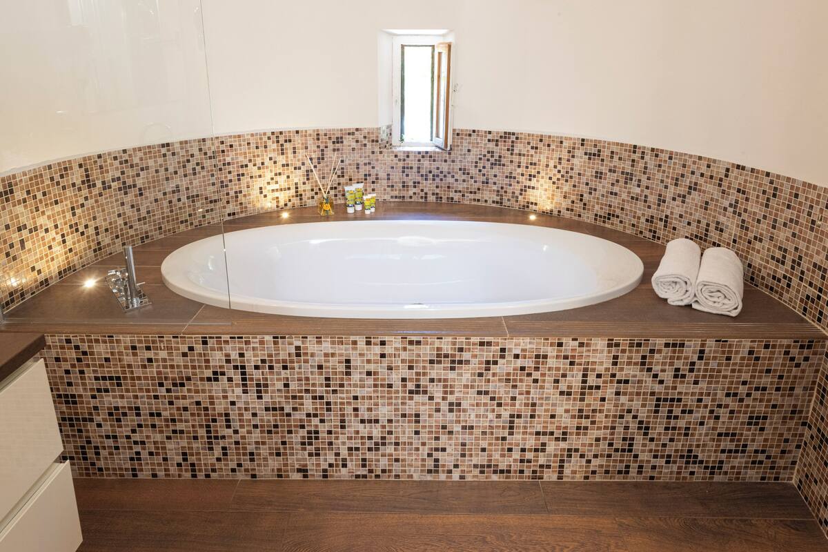 terrace suite | bathroom | eco-friendly toiletries, hair dryer, slippers, bidet