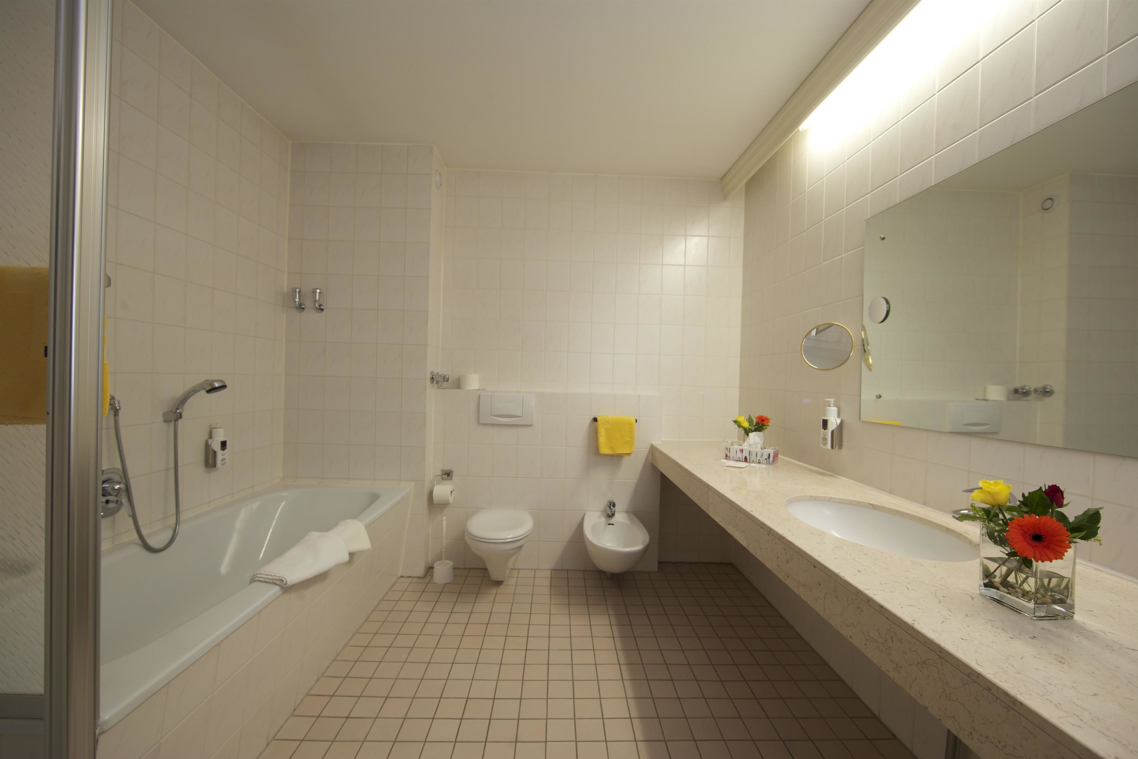 deluxe double room | bathroom | free toiletries, hair dryer, towels