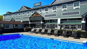 Seasonal outdoor pool, open 8:00 AM to 8:00 PM, pool umbrellas