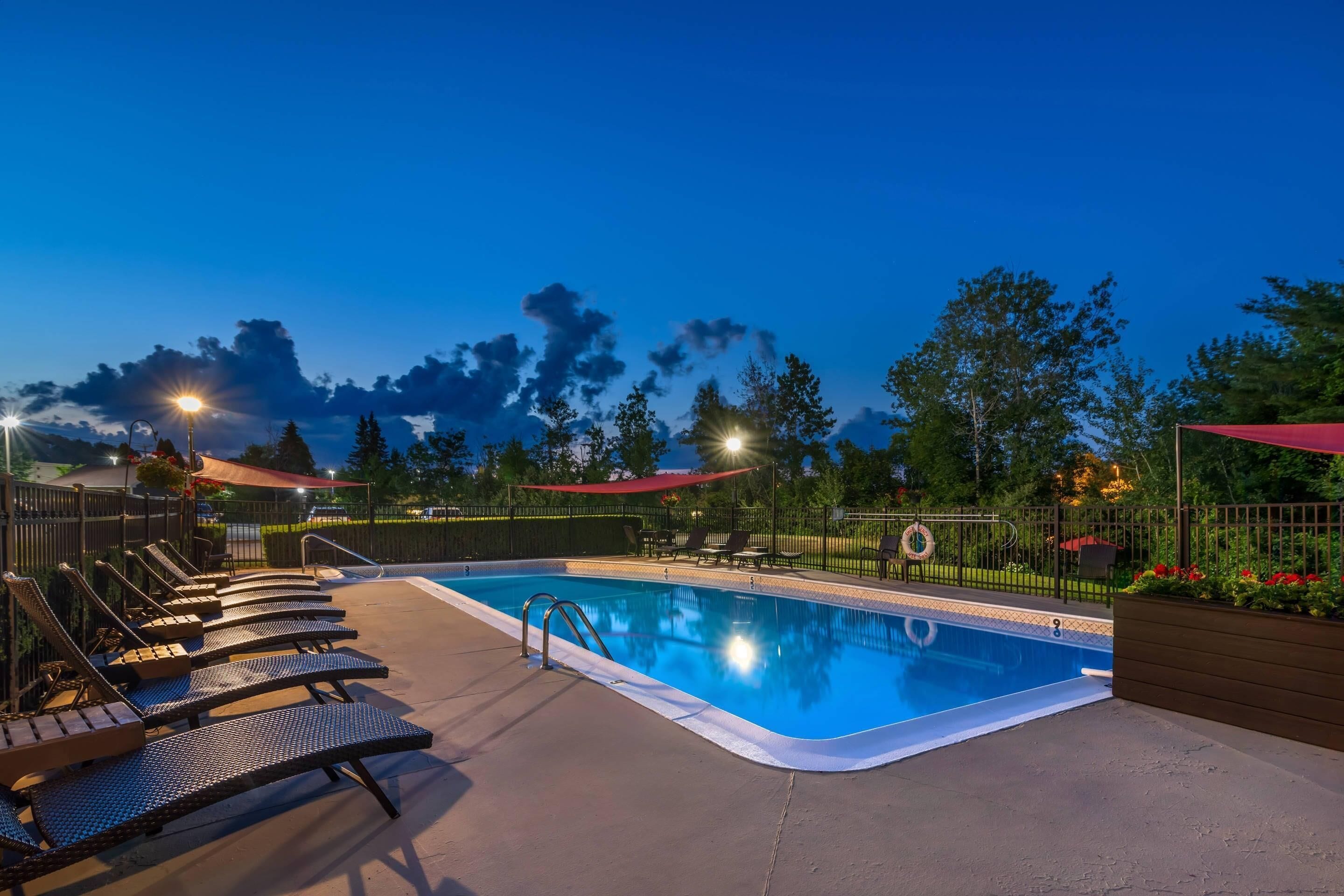 Seasonal outdoor pool, open 8:00 AM to 8:00 PM, pool umbrellas