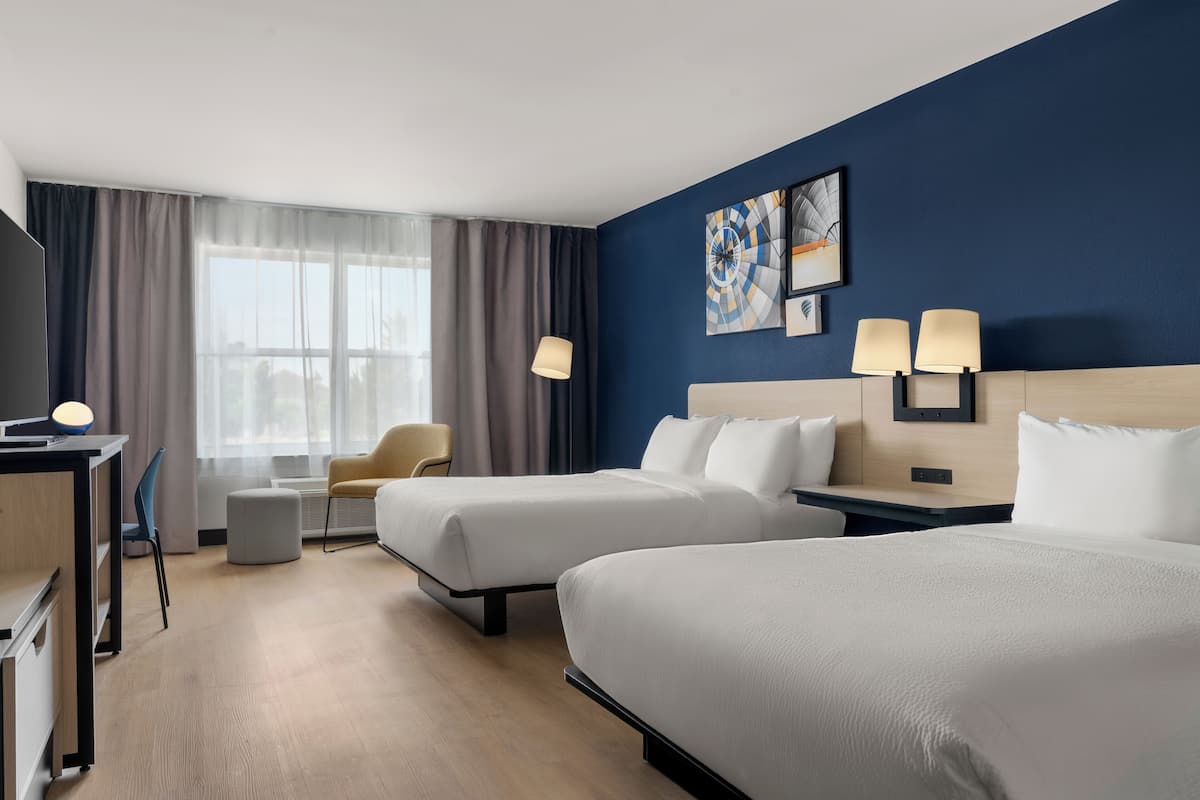 Premium bedding, desk, laptop workspace, blackout curtains