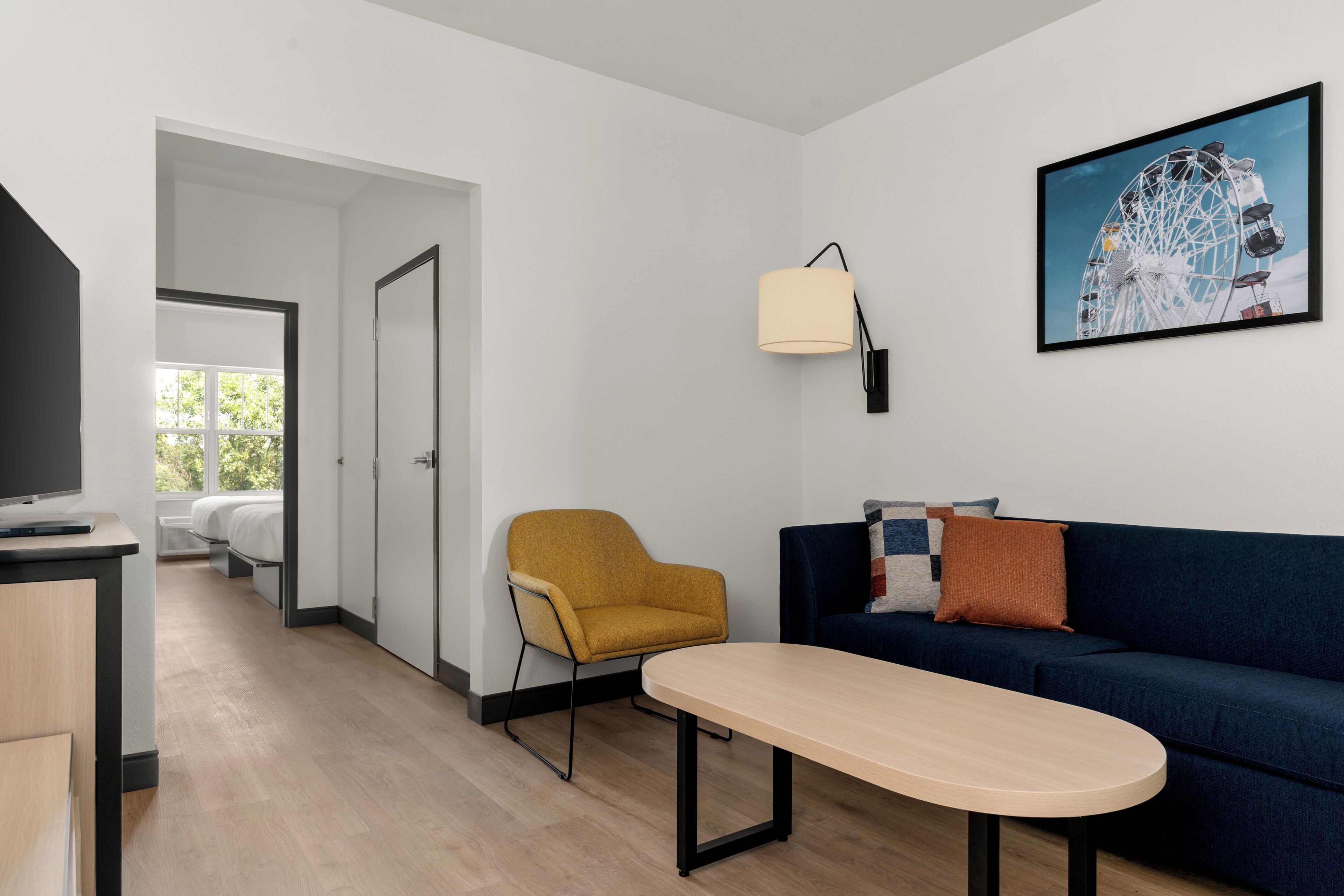 Premium bedding, desk, laptop workspace, blackout curtains