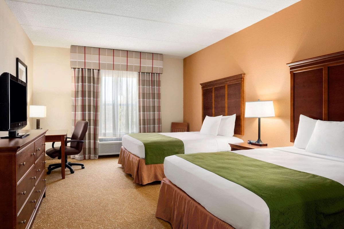 Hypo-allergenic bedding, desk, laptop workspace, blackout curtains