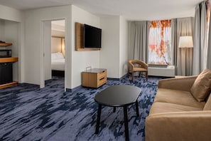 Suite, 1 Bedroom | Living area | 32-inch flat-screen TV with cable channels, TV