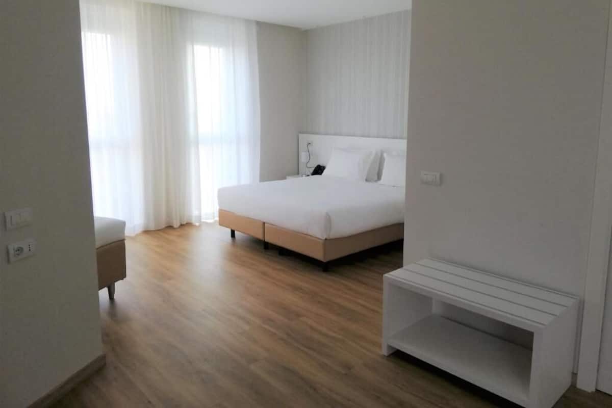 Quadruple Room | Hypo-allergenic bedding, minibar, desk, blackout drapes