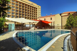 Seasonal outdoor pool, open 8:00 AM to 10 PM, pool umbrellas