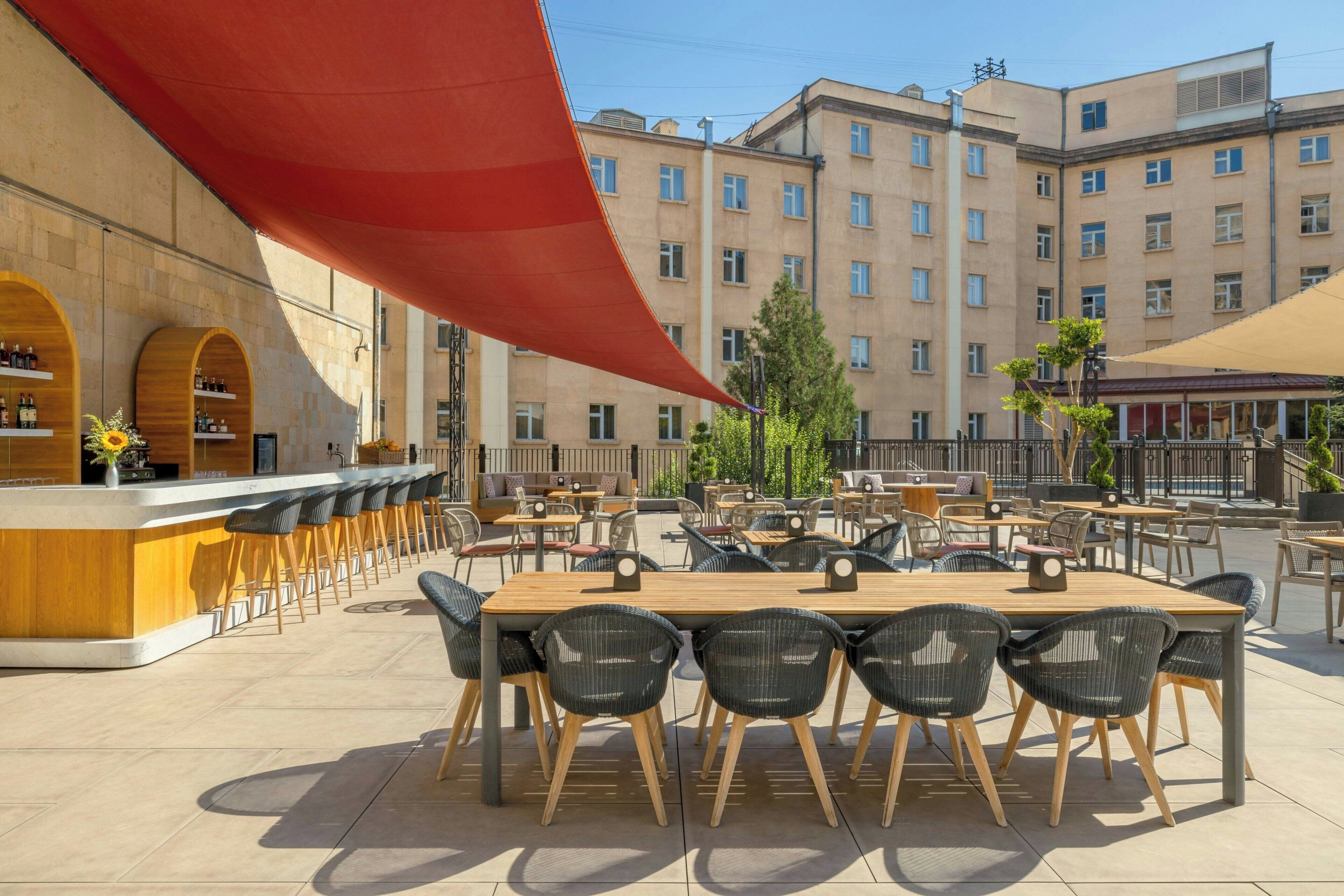 Seasonal outdoor pool, open 8:00 AM to 10 PM, pool umbrellas