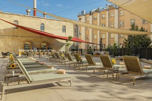 Seasonal outdoor pool, open 8:00 AM to 10 PM, pool umbrellas