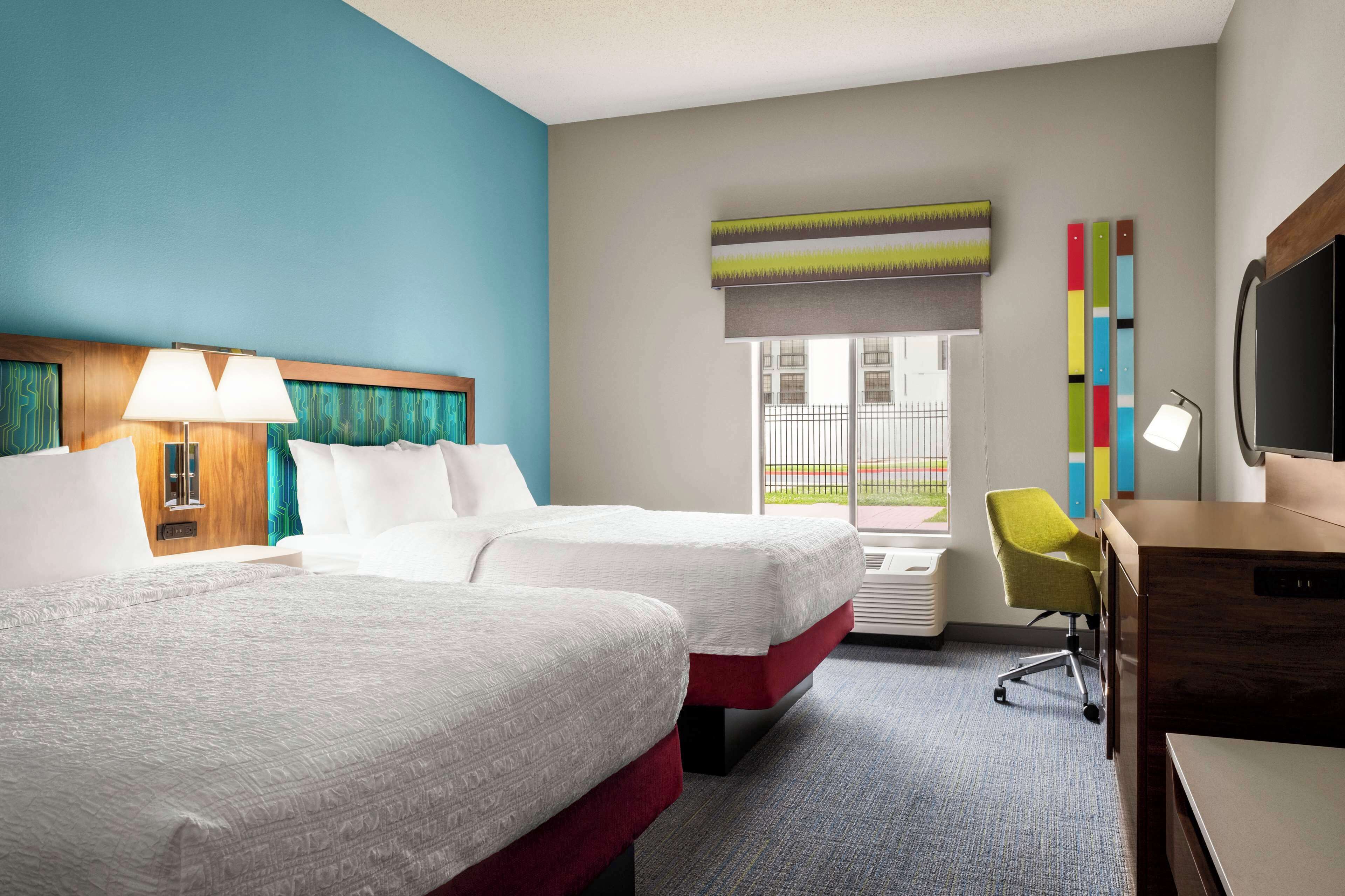 room, 2 queen beds, refrigerator | in-room safe, blackout curtains, free cots/infant beds, rollaway beds