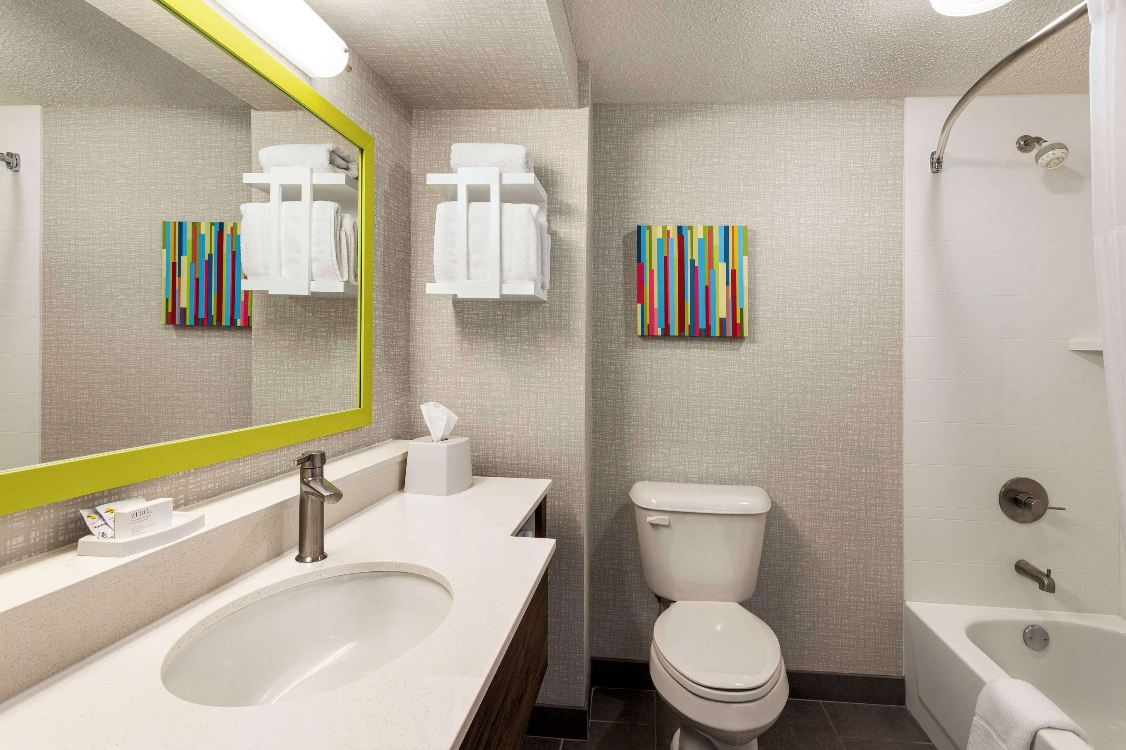 room, 2 queen beds, refrigerator | bathroom | combined shower/bathtub, free toiletries, towels