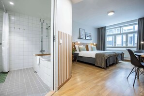 Premium bedding, pillowtop beds, laptop workspace, blackout drapes