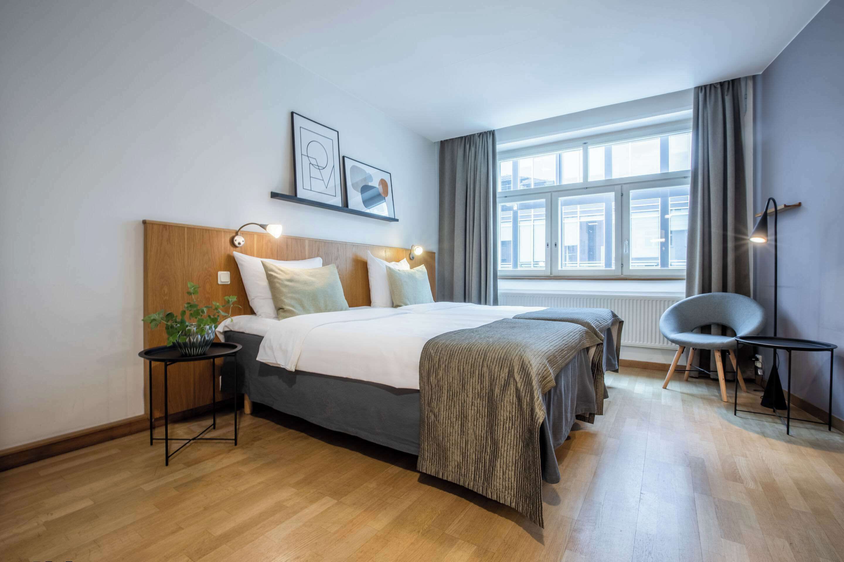 premium bedding, pillow-top beds, laptop workspace, blackout curtains