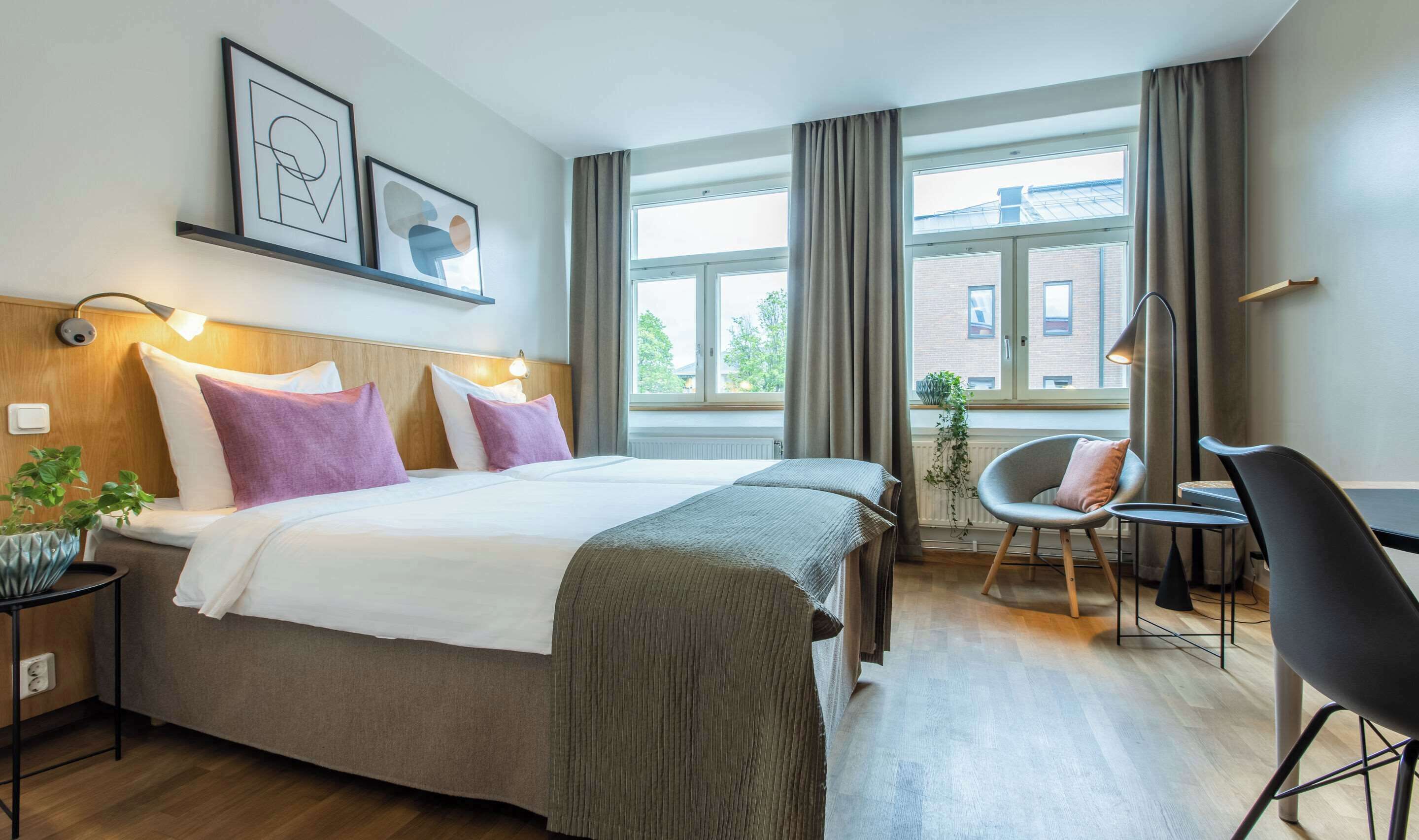 premium bedding, pillow-top beds, laptop workspace, blackout curtains