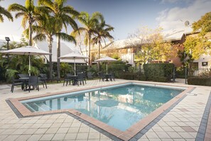 Outdoor pool, pool umbrellas, sun loungers