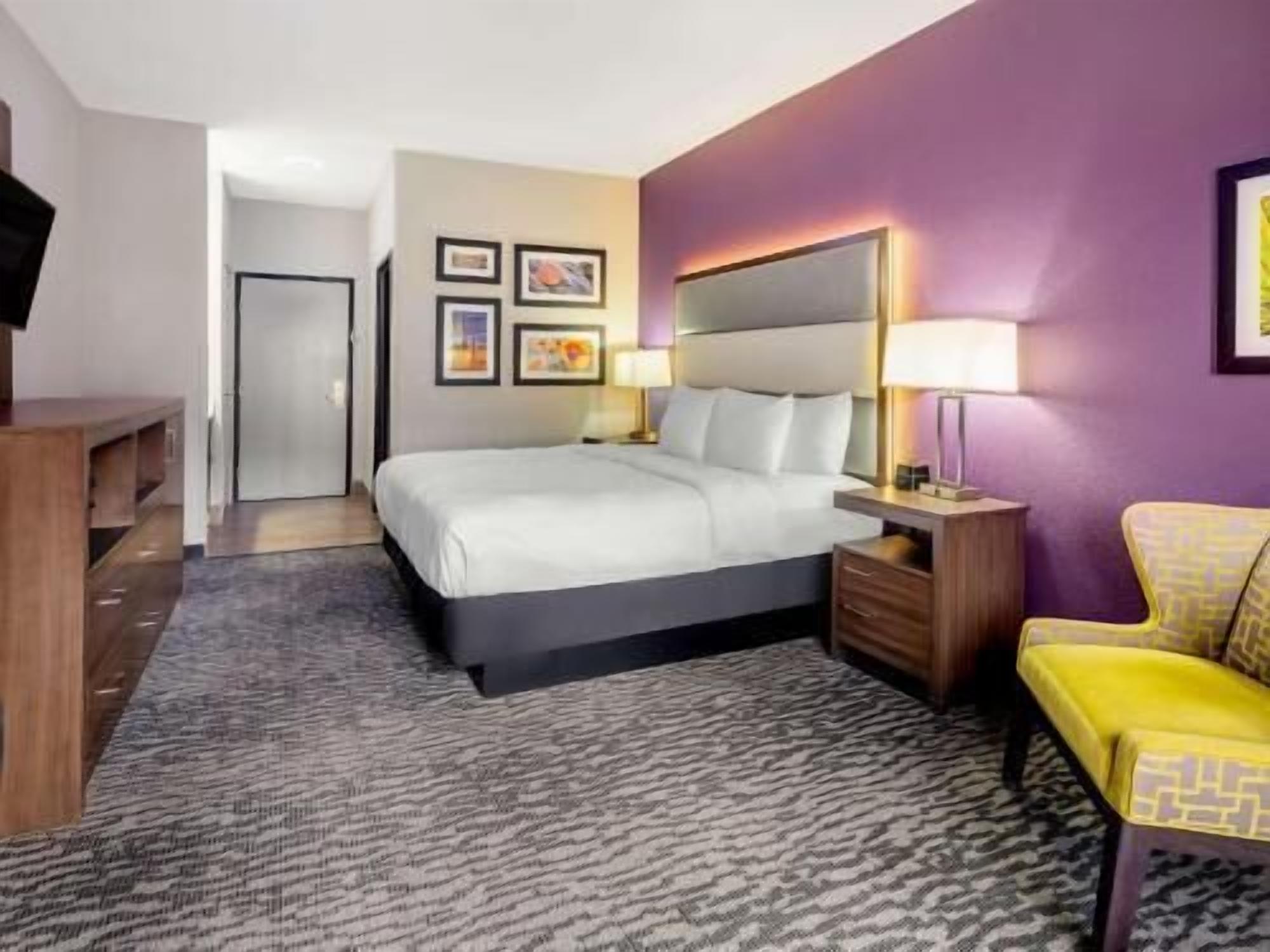 Premium bedding, desk, laptop workspace, blackout curtains