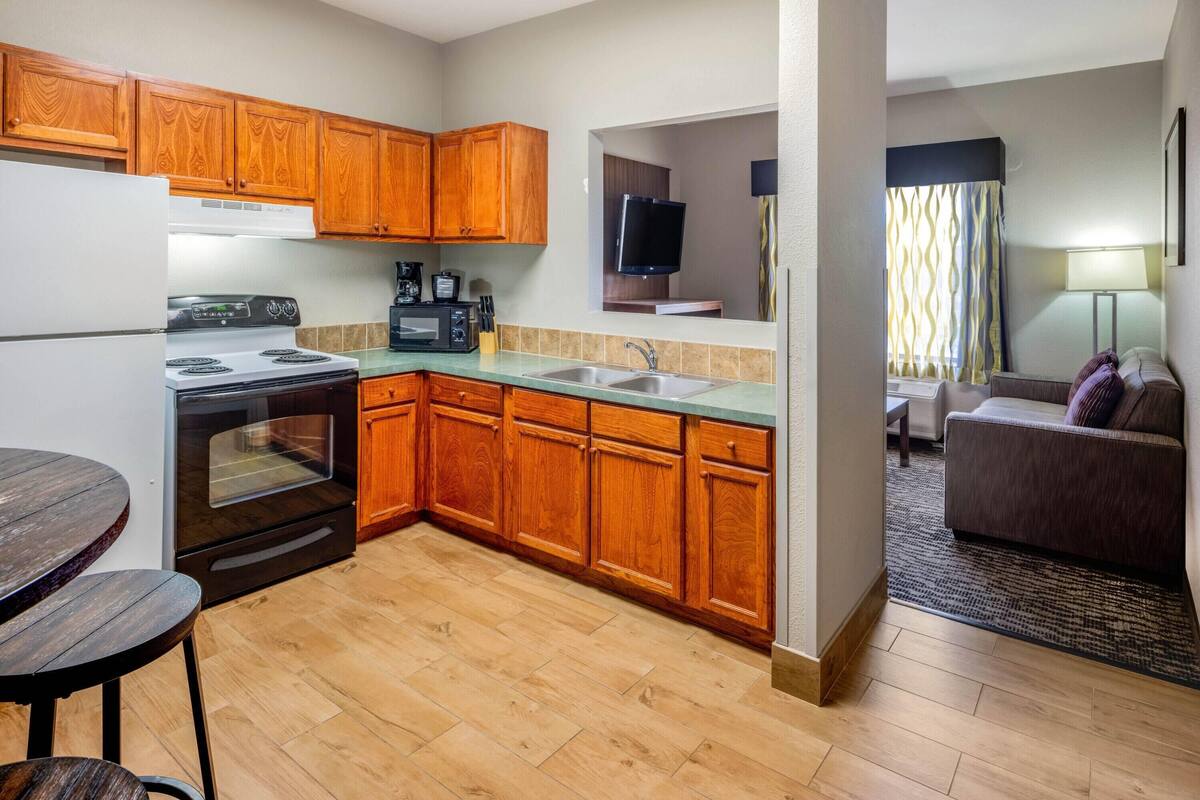 premium bedding, desk, laptop workspace, blackout curtains