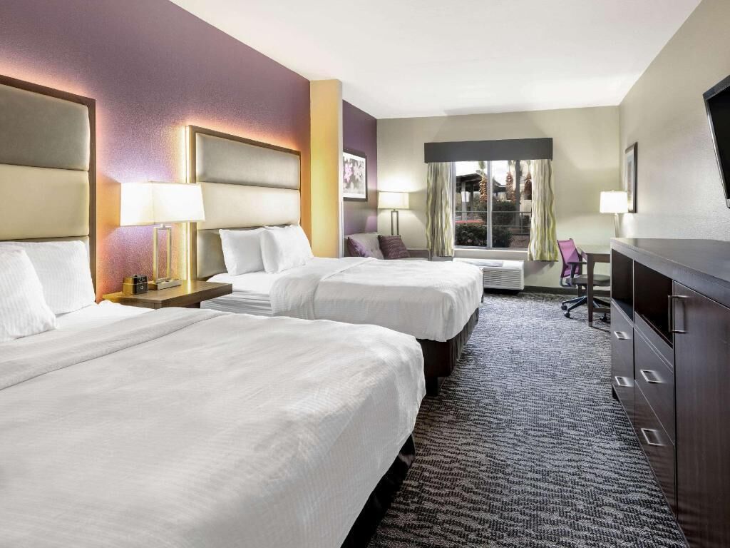 Premium bedding, desk, laptop workspace, blackout curtains