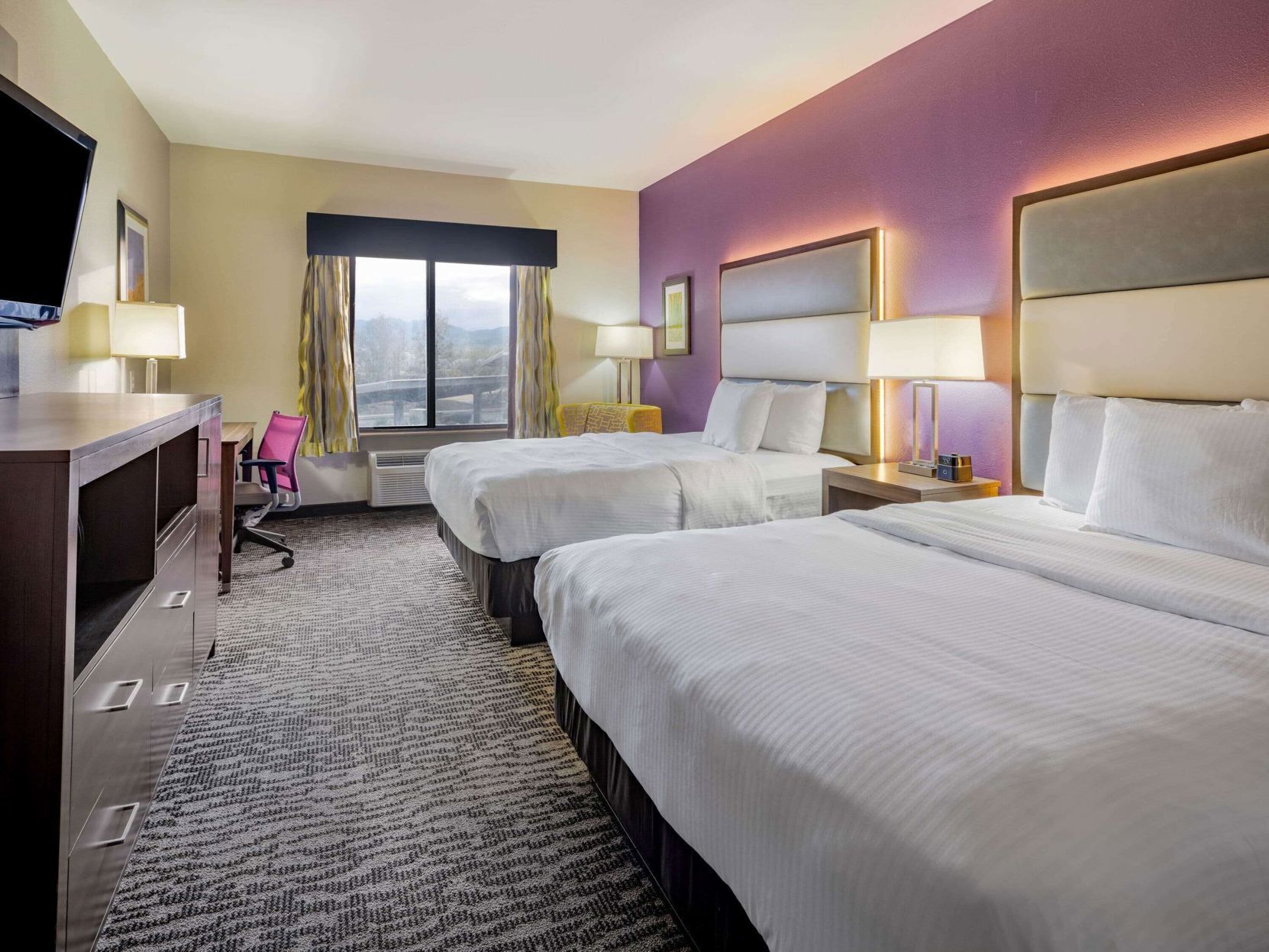 Premium bedding, desk, laptop workspace, blackout curtains