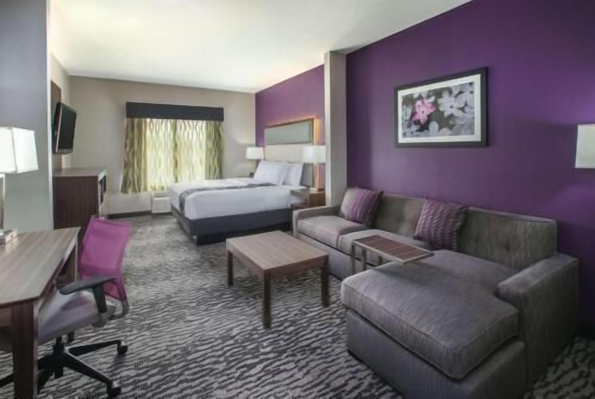 Premium bedding, desk, laptop workspace, blackout curtains