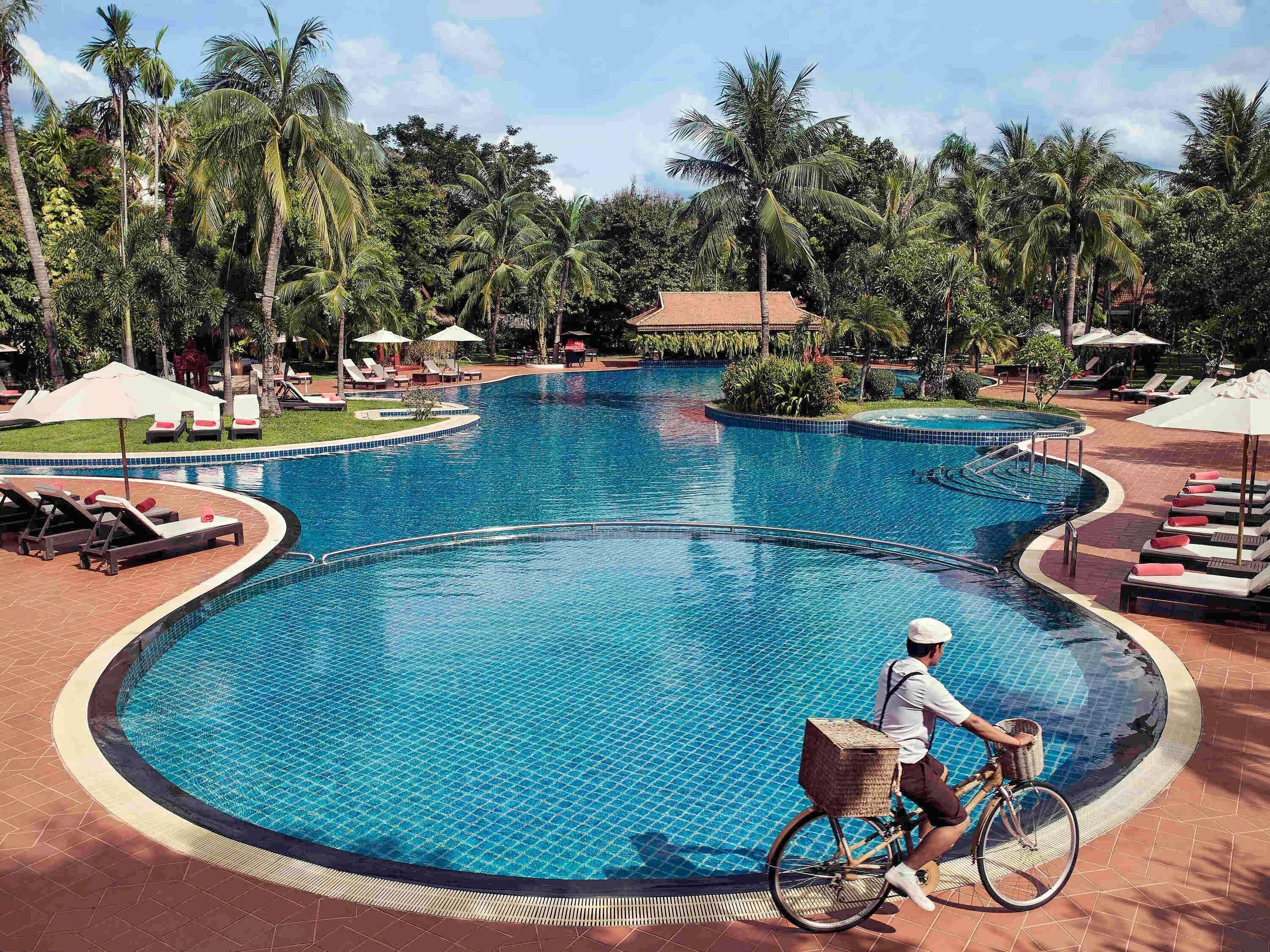 Outdoor pool, open 7:00 AM to 8:00 PM, free cabanas, pool umbrellas