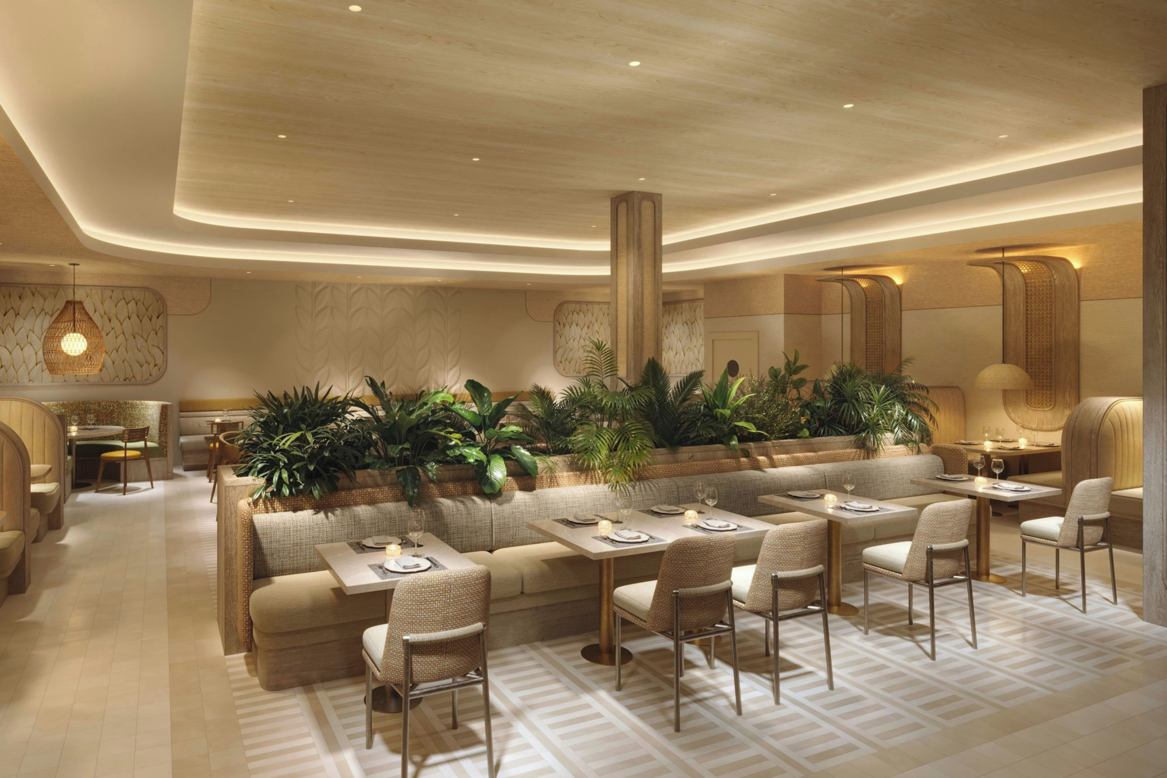 Un restaurante moderno con una larga mesa compartida, asientos acolchados e iluminación ambiental.