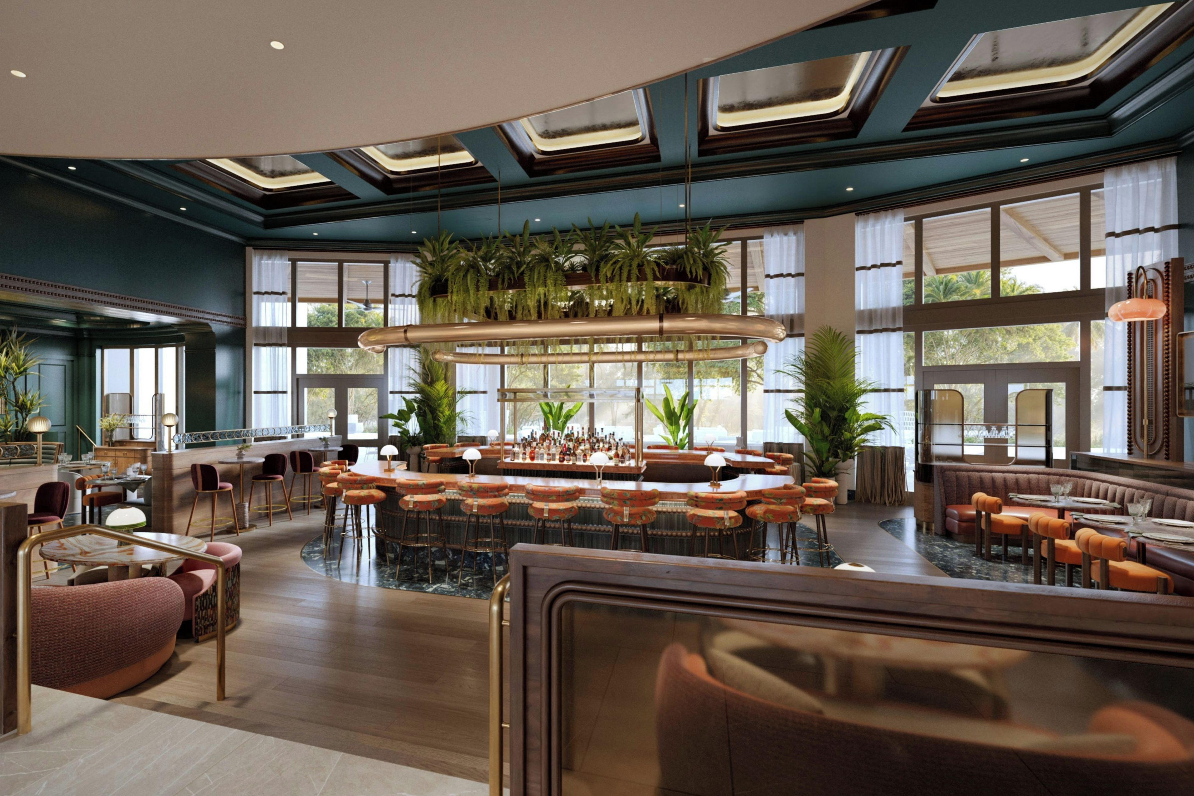 A spacious bar area with multiple seating options, including bar stools and cushioned chairs, surrounded by large windows and indoor plants.