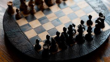 A chessboard on a wooden table.