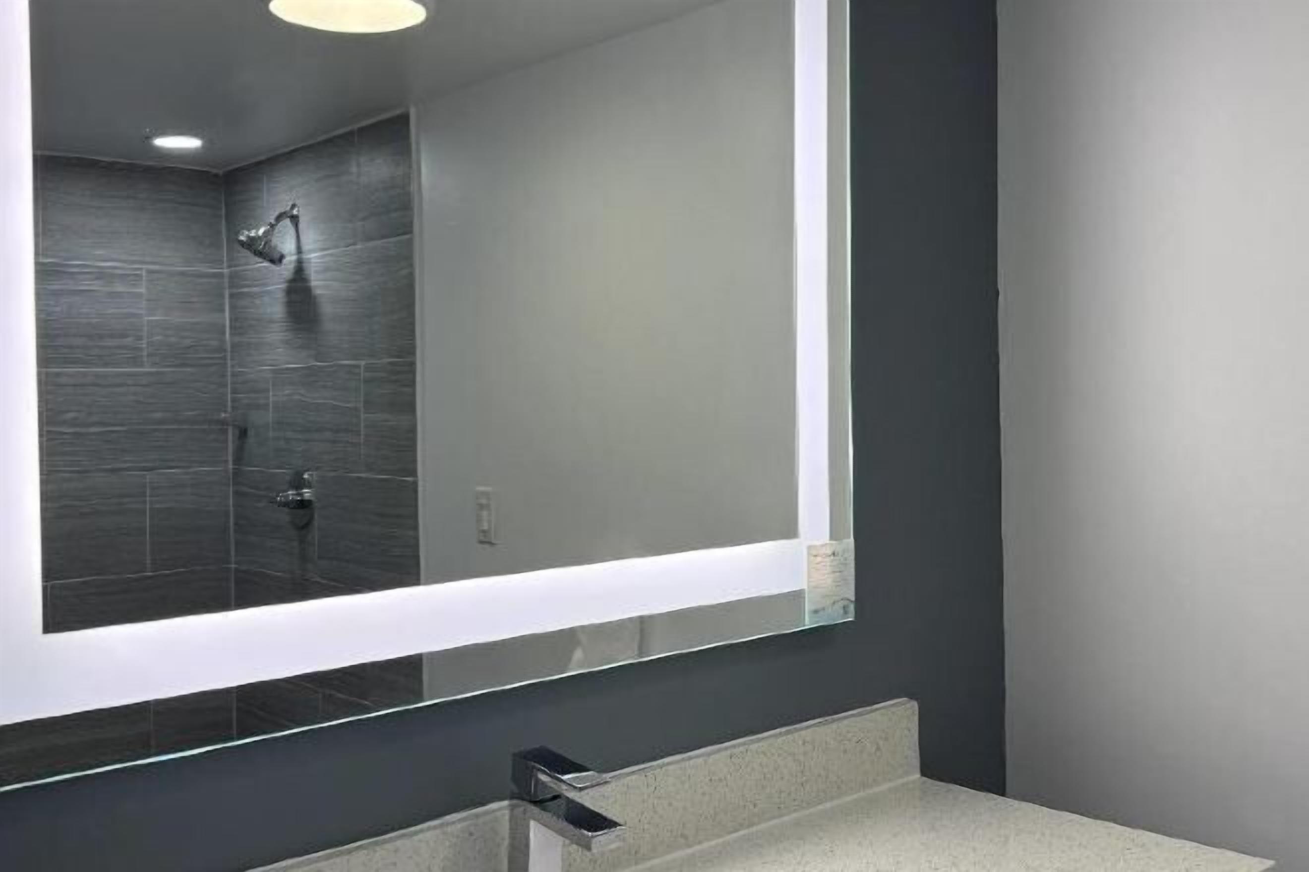 Designer toiletries, hair dryer, towels, soap