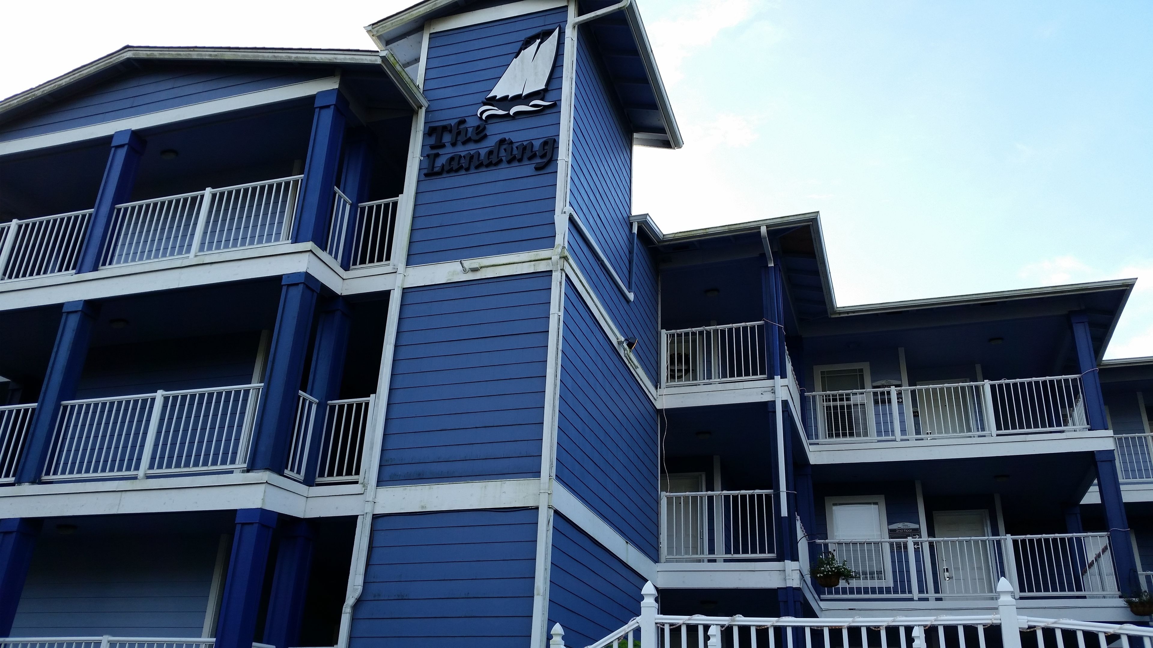 A multi-story hotel with balconies and a sign reading "The Landing".