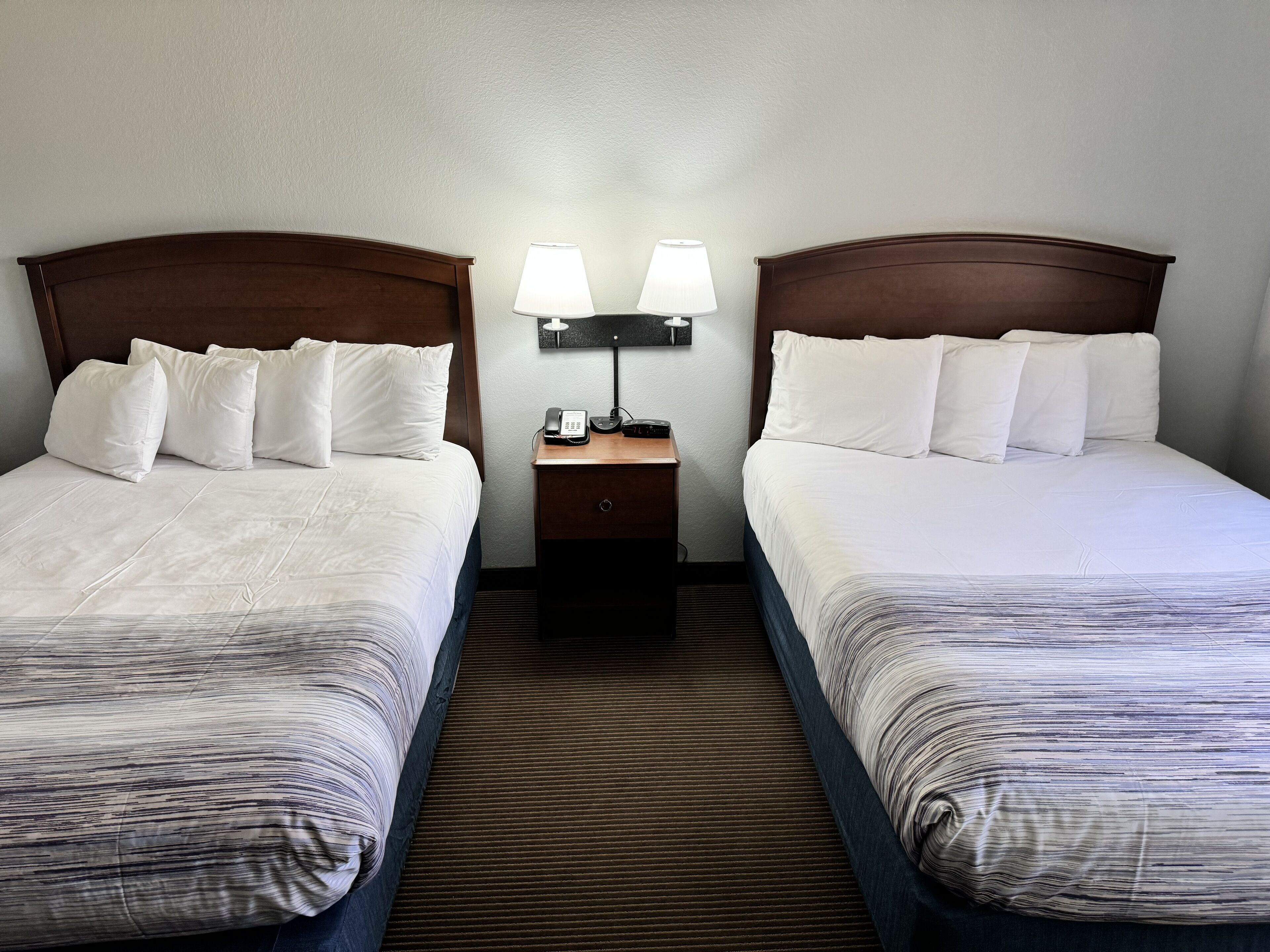 hypo-allergenic bedding, desk, laptop workspace, blackout curtains