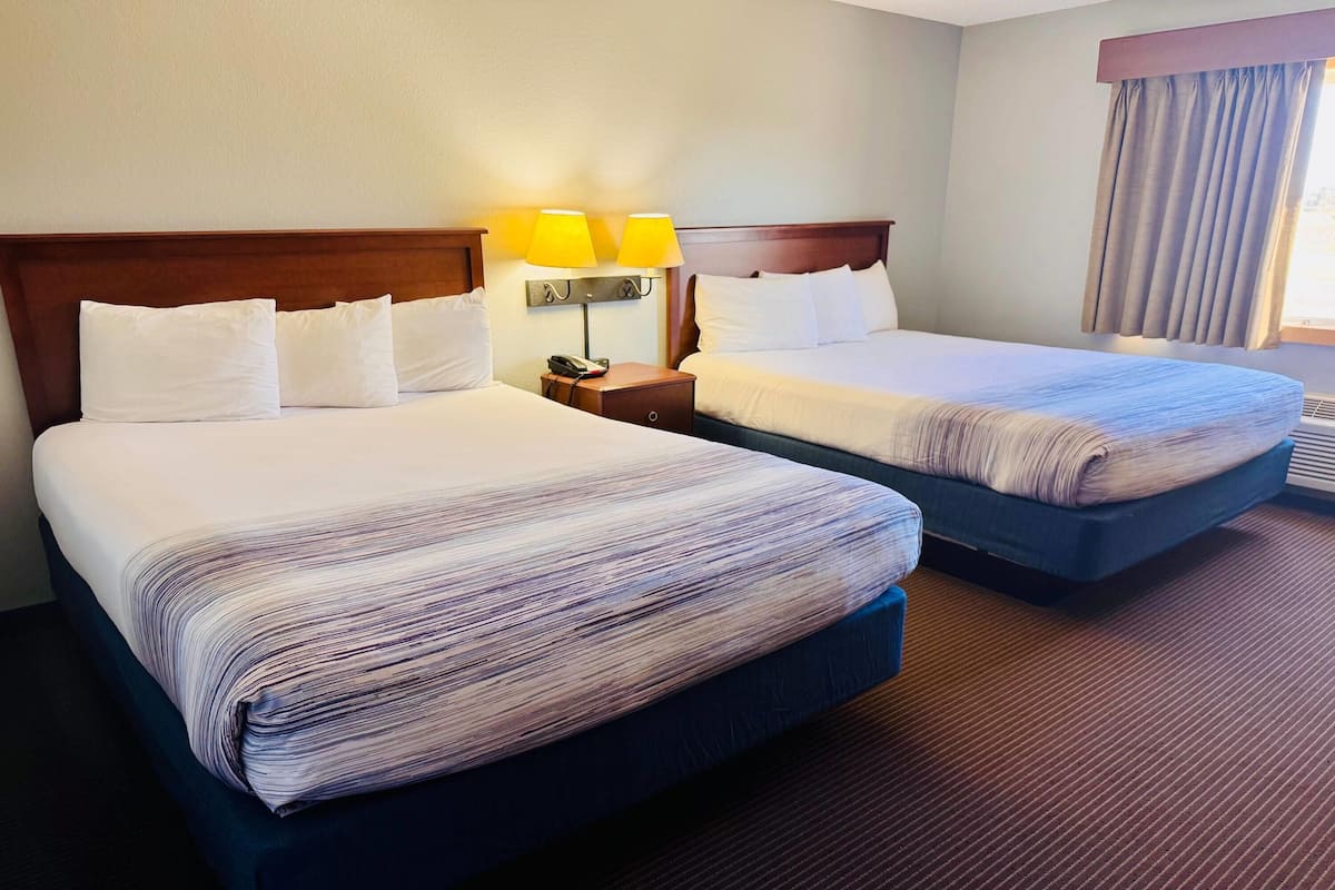 Hypo-allergenic bedding, desk, laptop workspace, blackout curtains