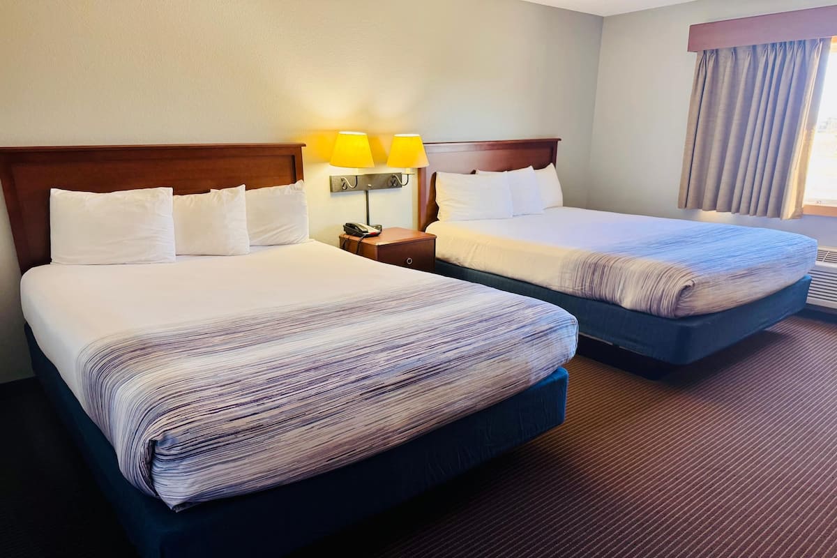 Hypo-allergenic bedding, desk, laptop workspace, blackout curtains