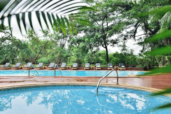 Outdoor pool, pool umbrellas, sun loungers