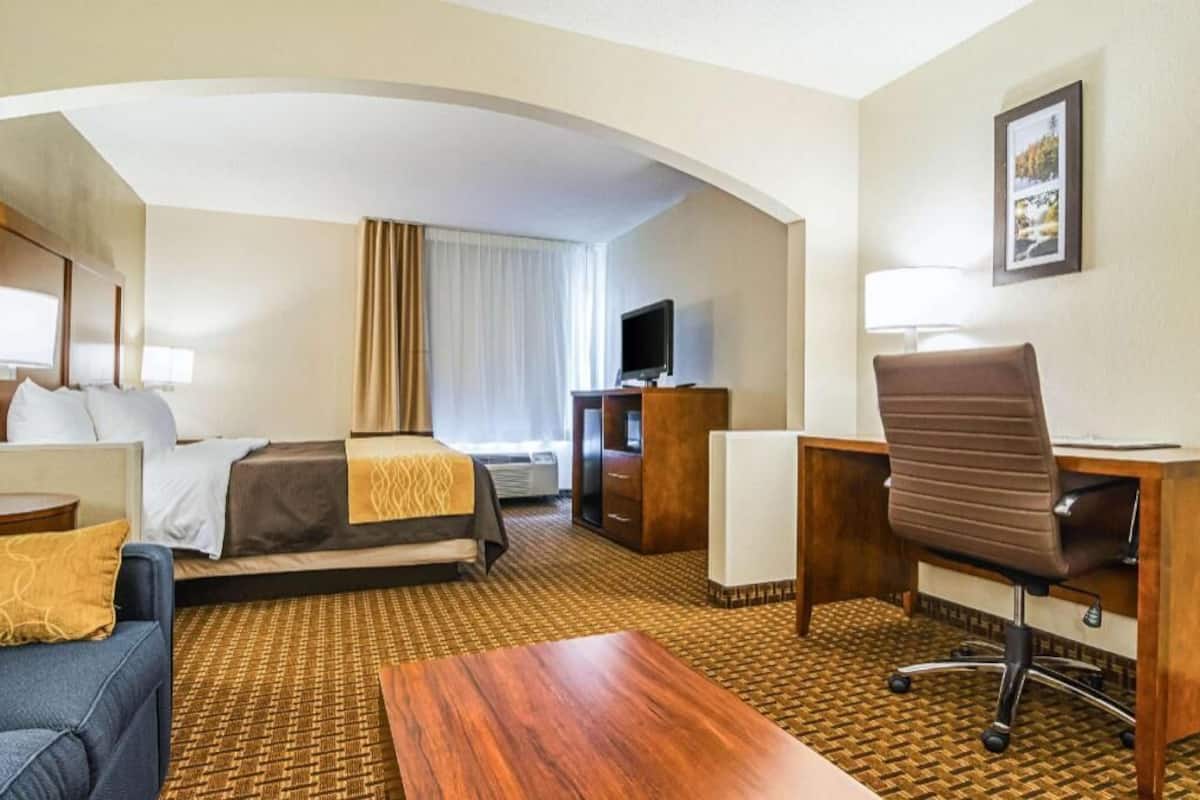 Premium bedding, desk, laptop workspace, iron/ironing board