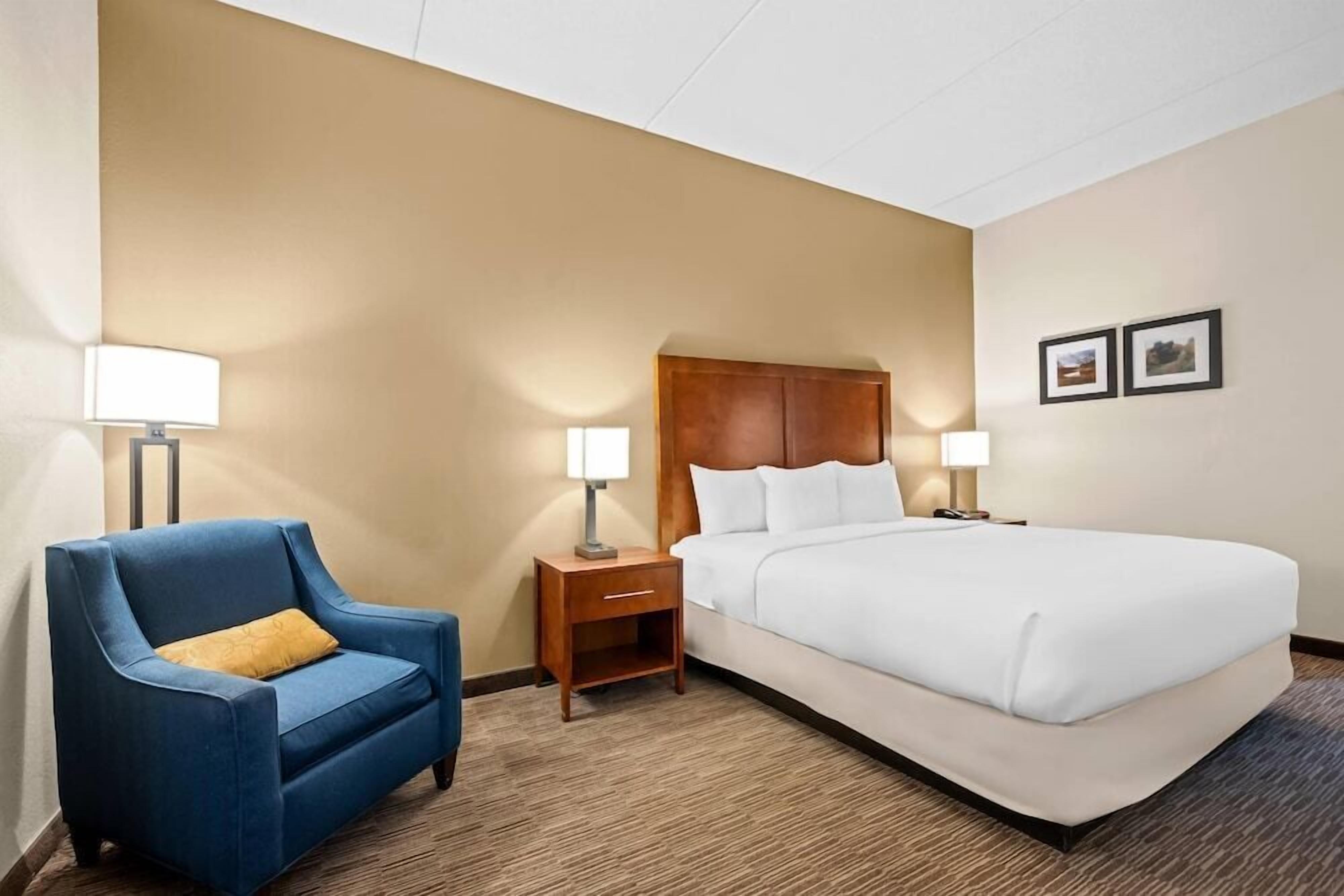 Premium bedding, desk, laptop workspace, iron/ironing board