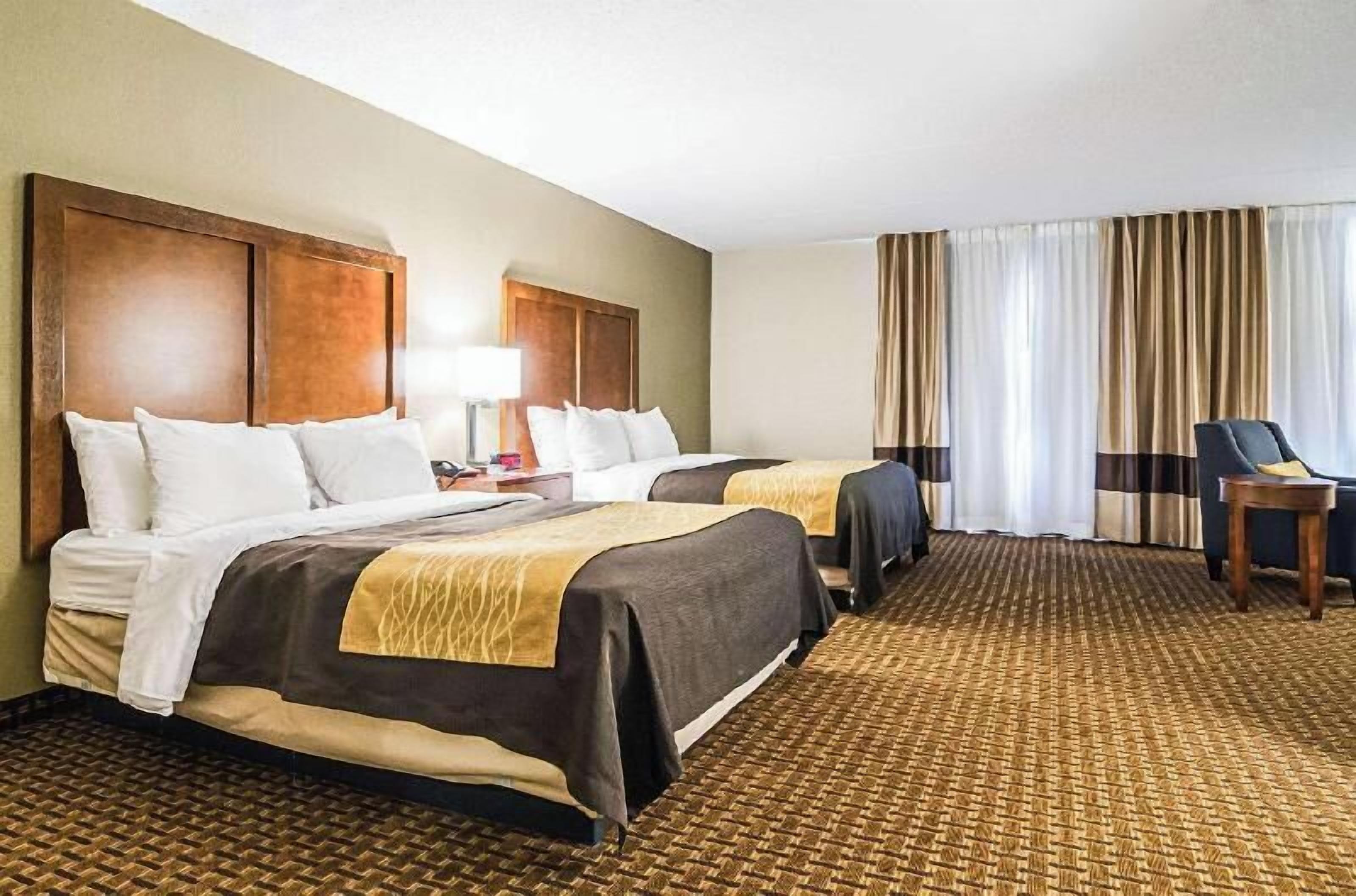 Premium bedding, desk, laptop workspace, iron/ironing board