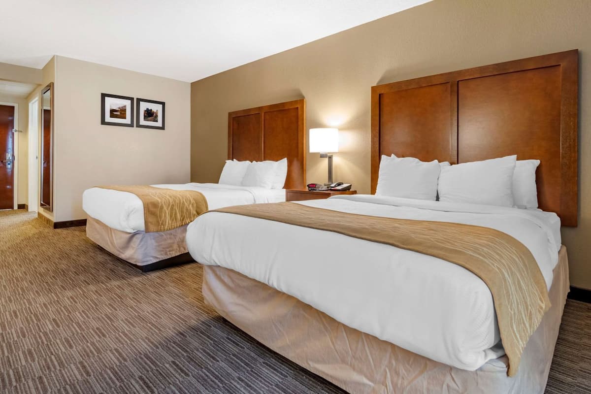 Premium bedding, desk, laptop workspace, iron/ironing board