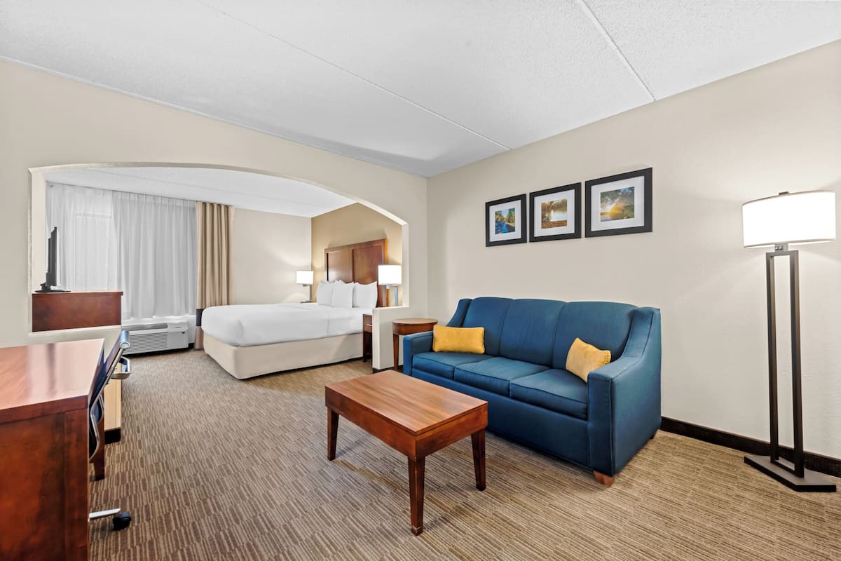 Premium bedding, desk, laptop workspace, iron/ironing board