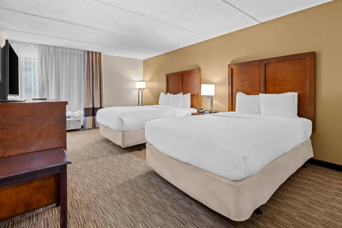 Premium bedding, desk, laptop workspace, iron/ironing board