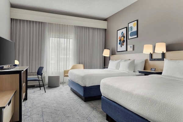 Premium bedding, desk, laptop workspace, iron/ironing board