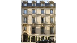 A multi-story building with a classic architectural style, featuring symmetrical windows and a central entrance. - Pershing Hall (Paris)