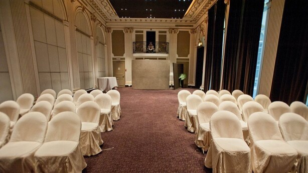 A formal room with rows of chairs and a central podium, likely for events or ceremonies. - Pershing Hall (Paris)