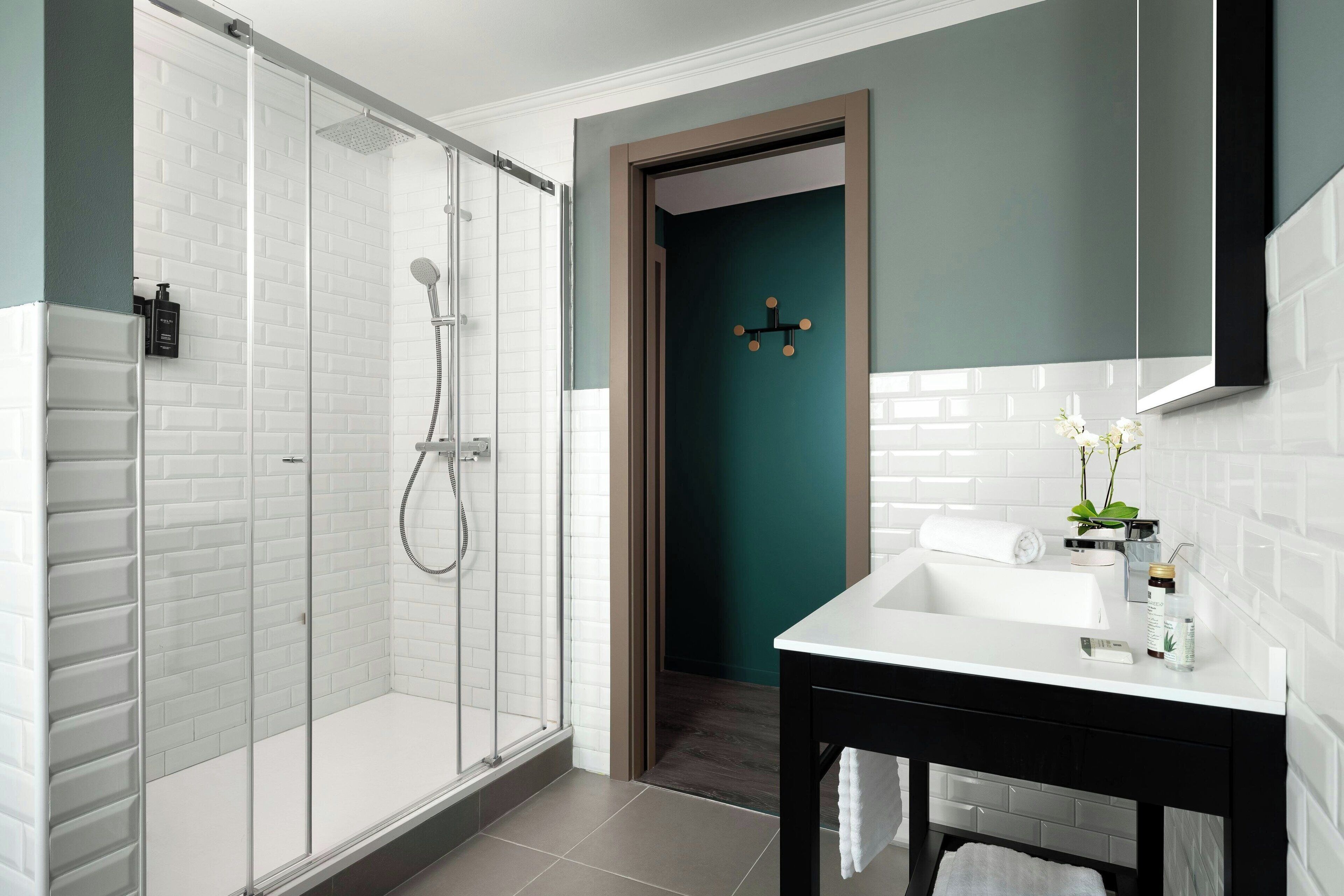 suite, 1 king bed with sofa bed | bathroom | rainfall showerhead, hair dryer, bidet, towels