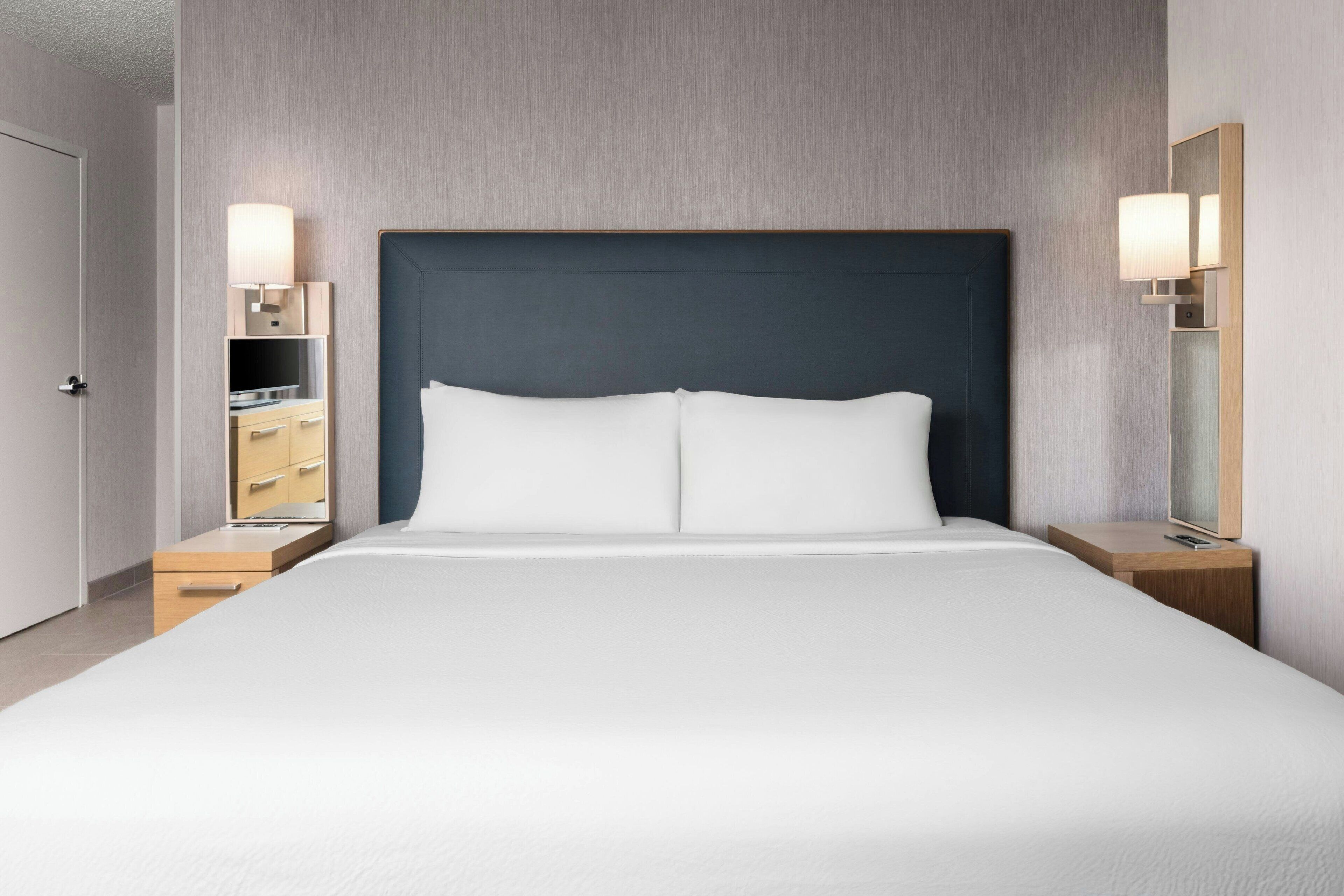 Desk, blackout drapes, iron/ironing board, free cribs/infant beds