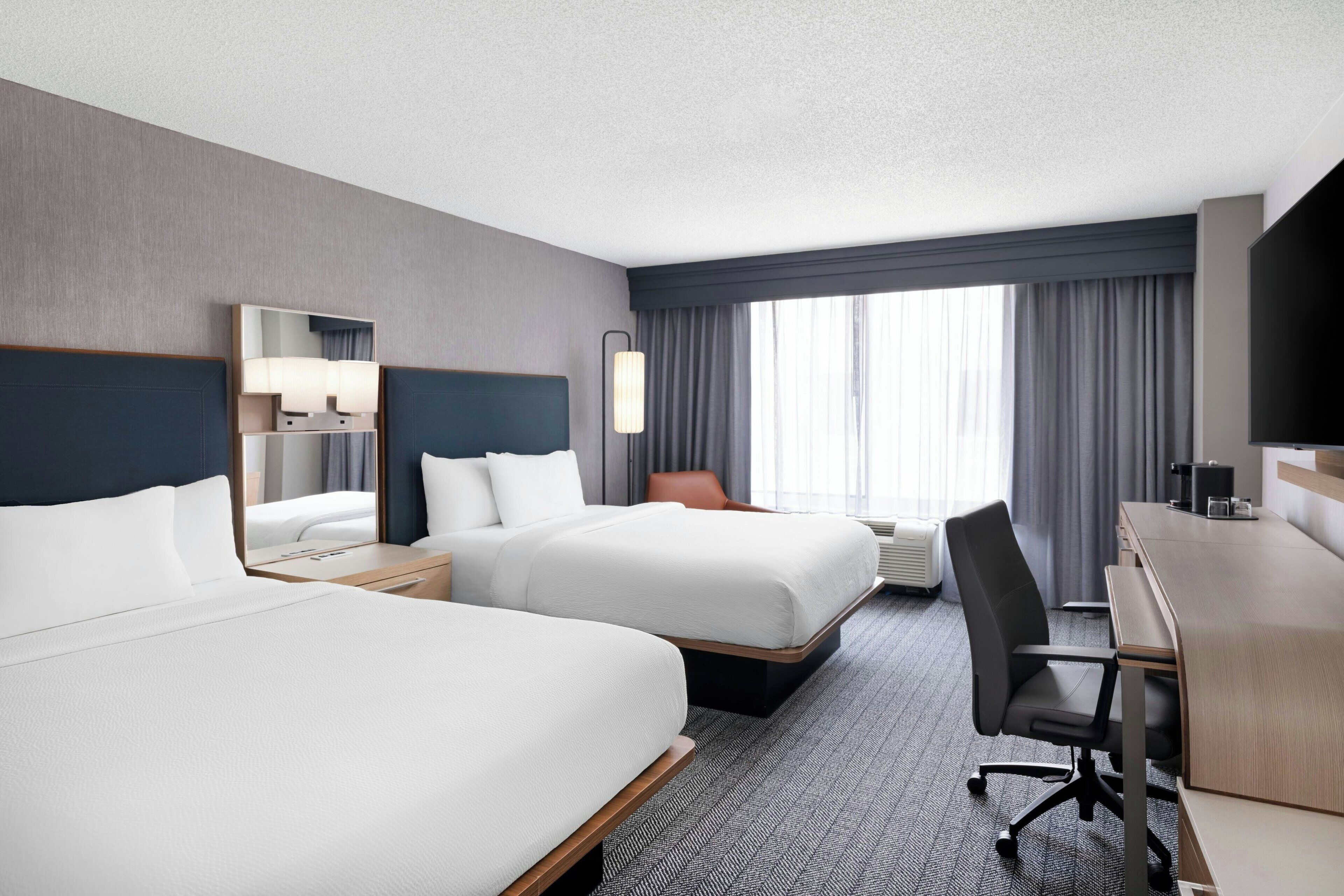 Desk, blackout drapes, iron/ironing board, free cribs/infant beds