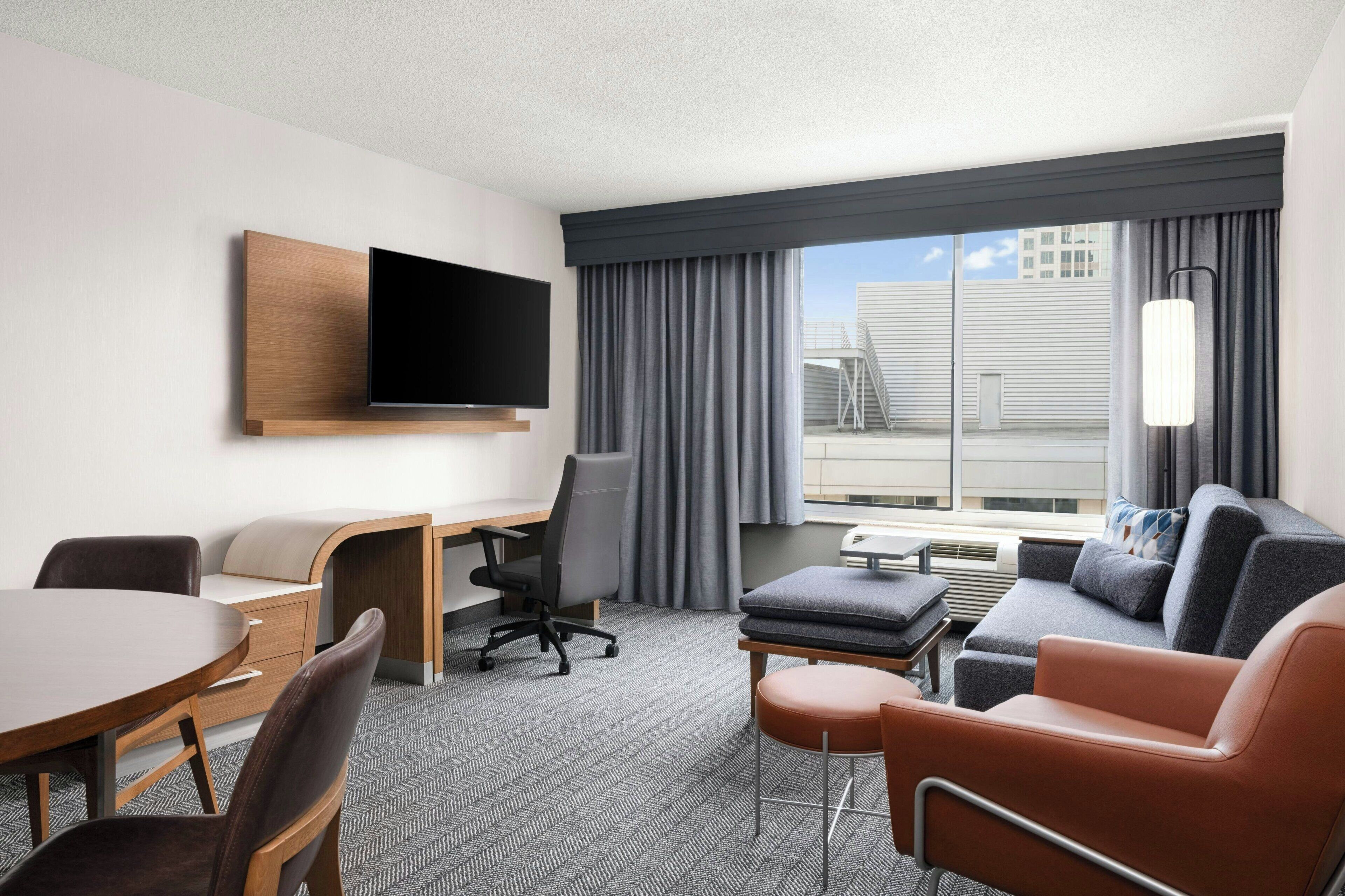 suite, 1 bedroom | living area | 32-inch flat-screen tv with cable channels, tv