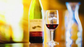 A bottle of wine and a glass with the label "STONE HILL WINERY" in Hermann, Missouri.