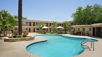 Outdoor pool, open 9:00 AM to 9 PM, pool umbrellas, pool loungers