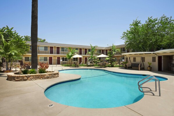 Outdoor pool, open 9:00 AM to 9 PM, pool umbrellas, sun loungers